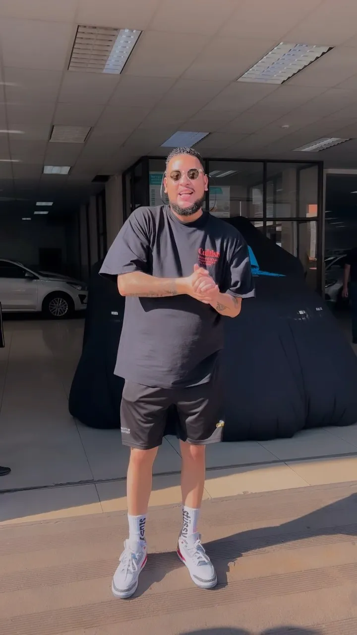 AKA shows off his new BMW car
