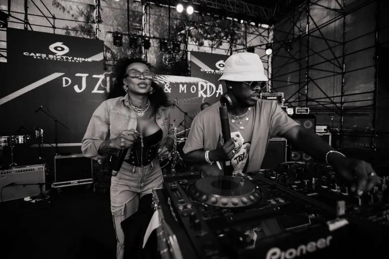Murdah Bongz and DJ Zinhle having a good moment while performing at a show