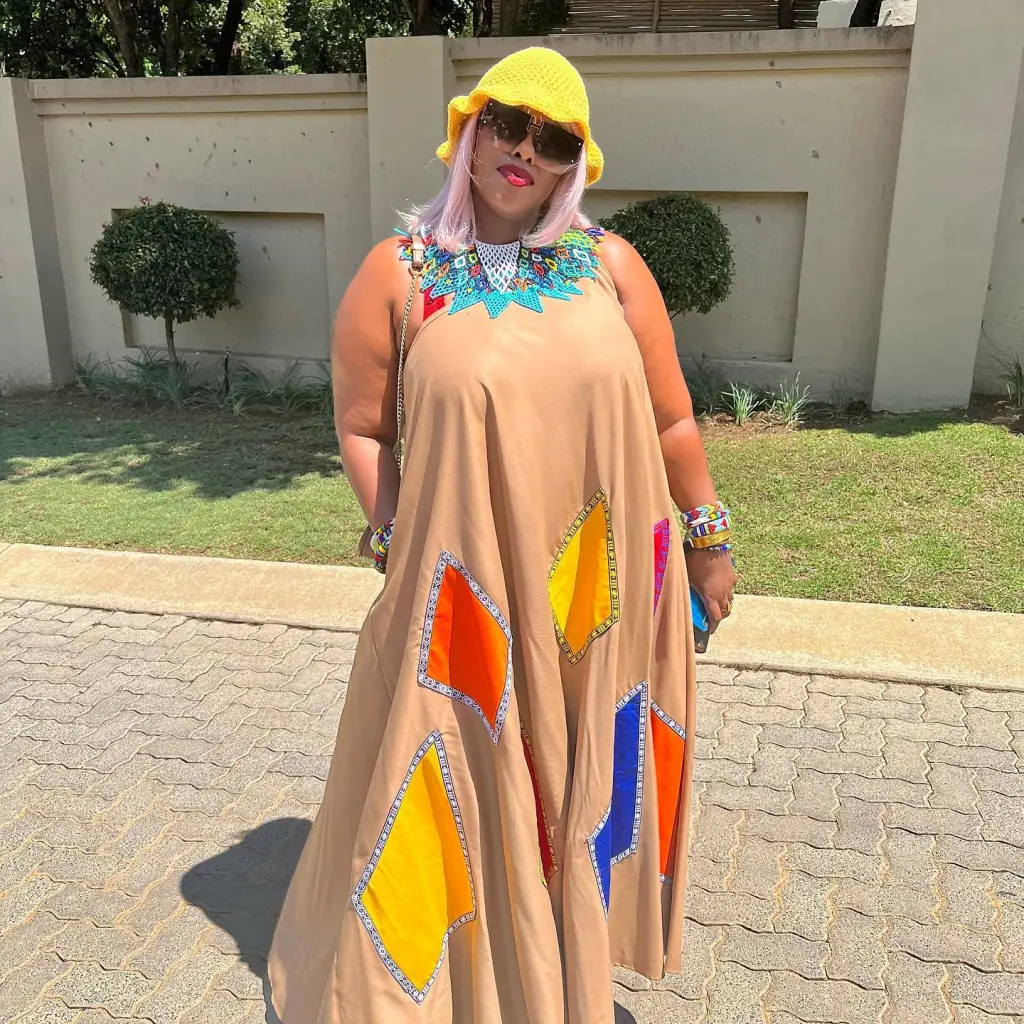 Actress Dawn Thandeka King standing on business